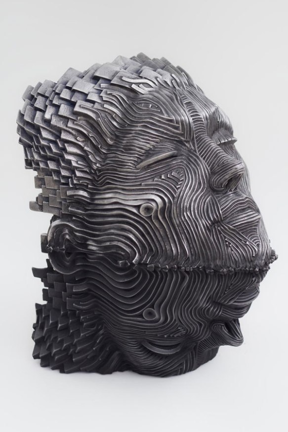 9-man-face-steel-scultpure-by-gil-bruvel